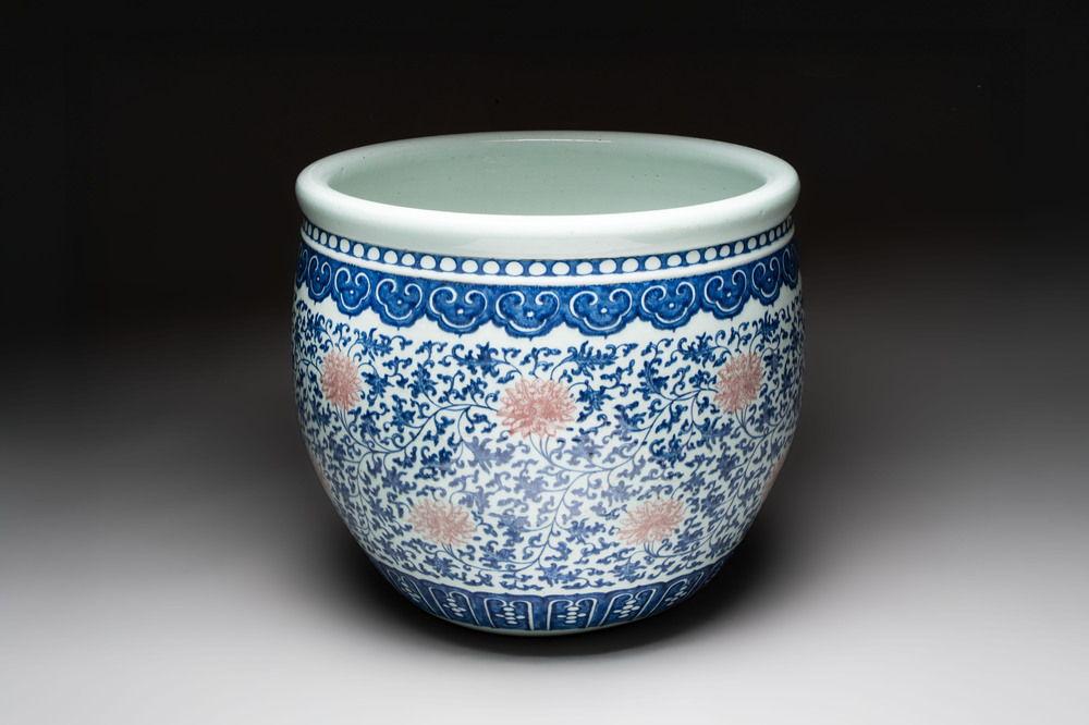 A fine Chinese blue, white and copper-red 'lotus scroll' fish bowl, Qianlong