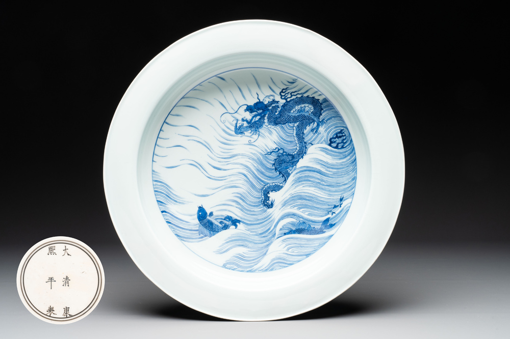 A rare large imperial Chinese blue and white 'dragon and carps' basin, Kangxi mark and of the period