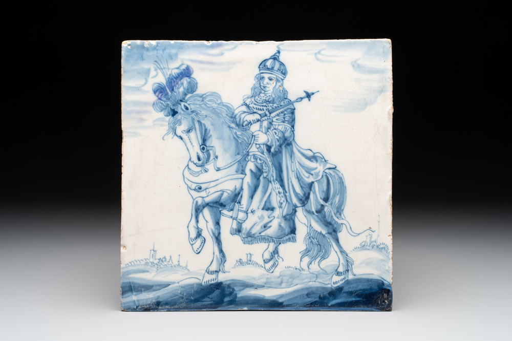 A rare and large blue and white Dutch Delft 'sovereign on horseback' tile, first half 17th C.
