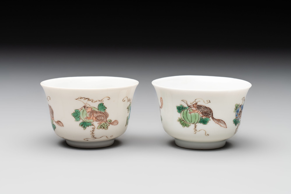 A pair of Chinese famille verte 'squirrels and melons' cups, Chenghua mark, Kangxi