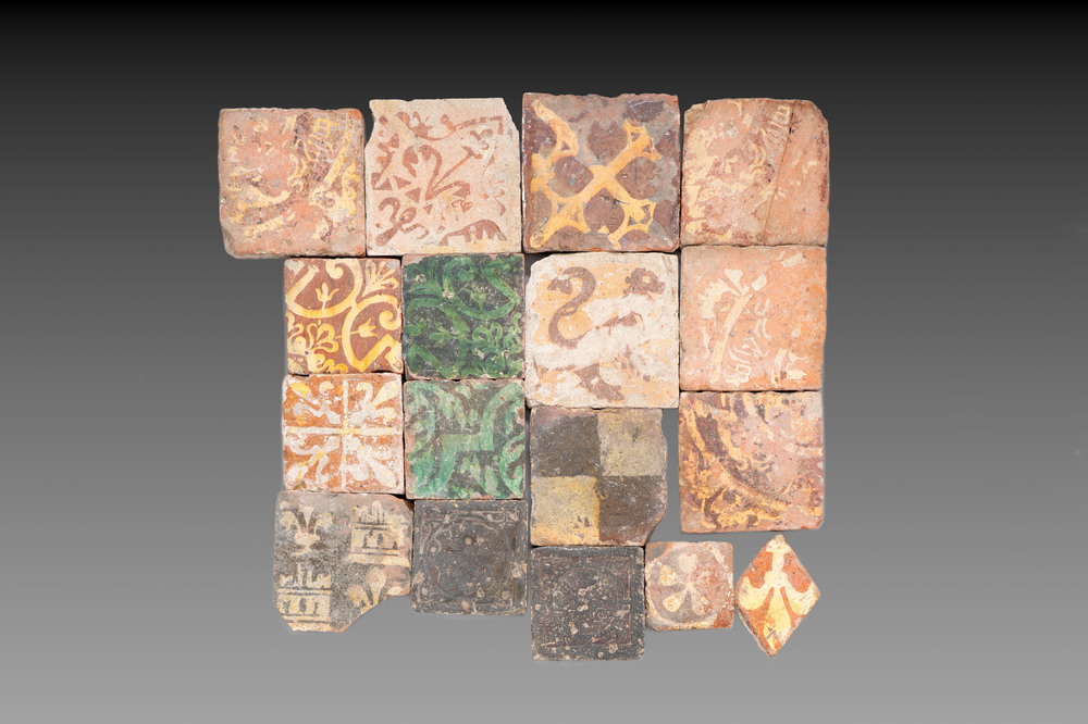 A varied collection of 17 slip-decorated medieval and post-medieval tiles, France and Flanders, 14/17th C.