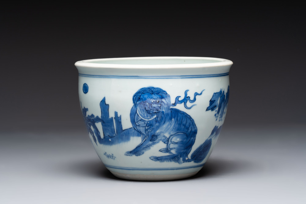 A Chinese blue and white 'Buddhist lion and elephant' scroll jar or jardini&egrave;re, Transitional period