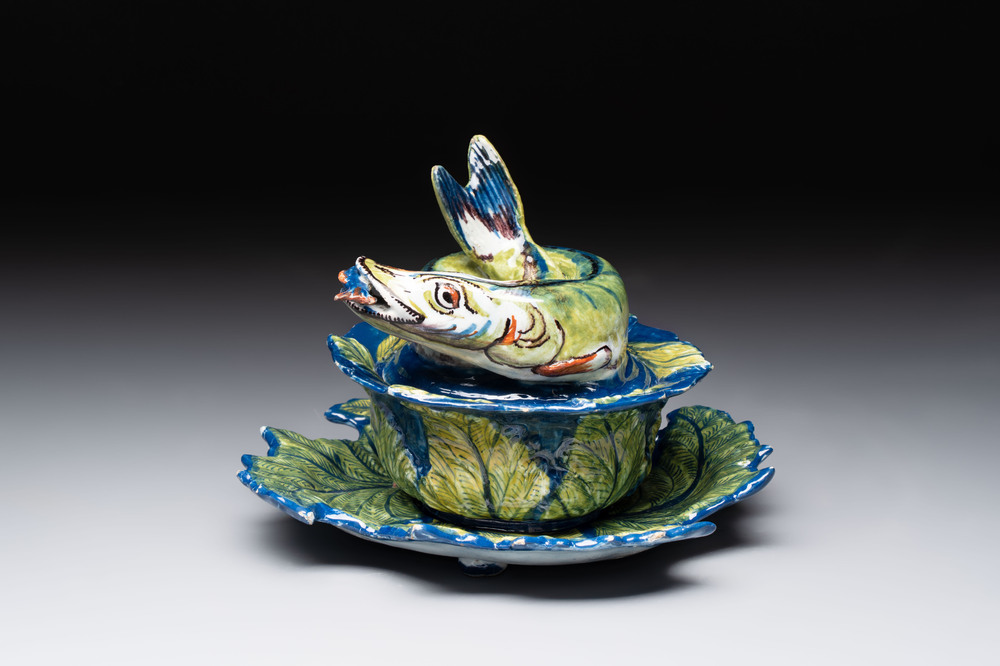 A rare polychrome Dutch Delft pike tureen and cover on stand, 18th C.