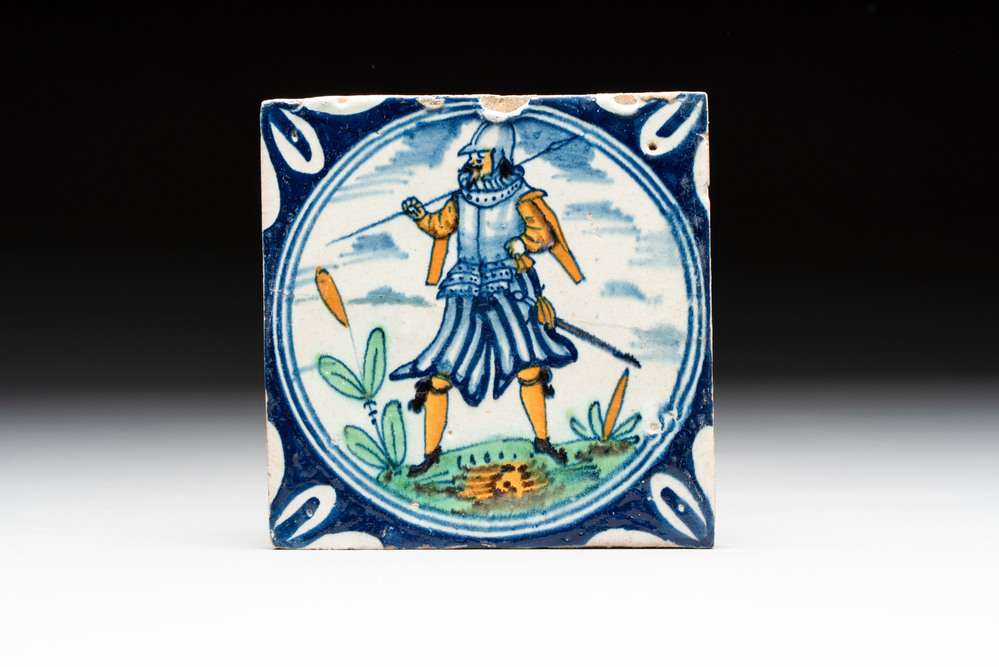 A polychrome Dutch Delft maiolica 'soldier' ​​medallion tile, late 16th C.