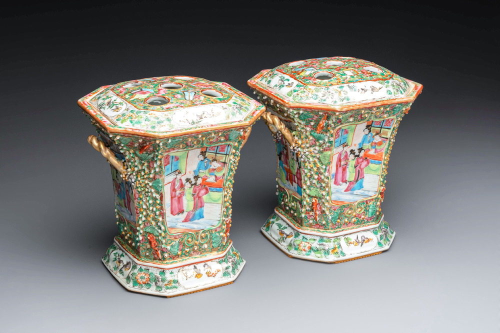 A pair of Chinese Canton famille rose flower holders and covers with figural design, 19th C.