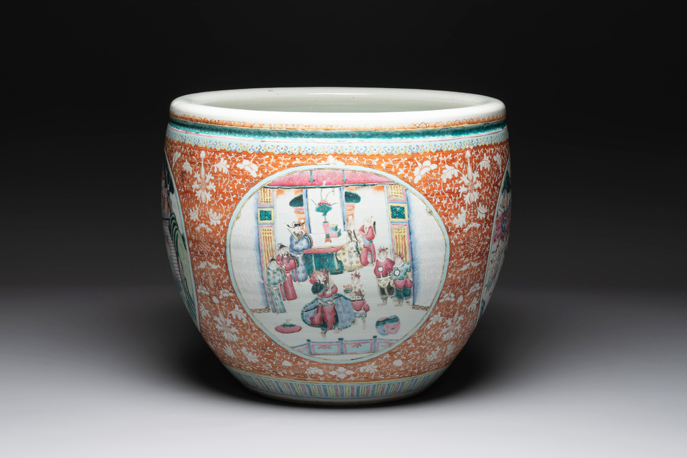 A large Chinese famille rose coral-red-ground fish bowl with narrative design, 19th C.