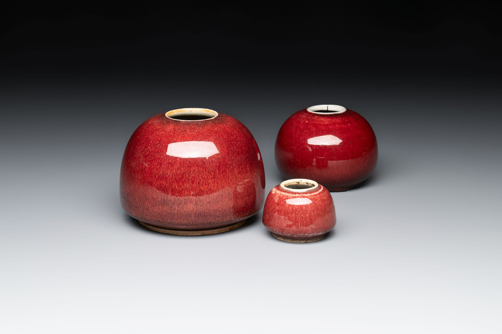Three Chinese copper-red-glazed water pots, Kangxi mark, 19th C.