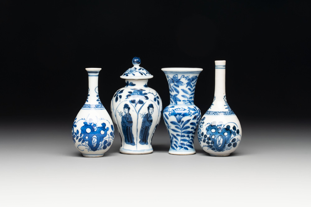 Four Chinese blue and white miniature vases, one with cover, Kangxi