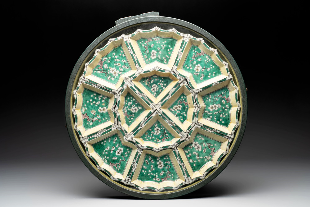 A Chinese verte biscuit 12-piece 'plum blossoms' sweetmeat set in a case, Kangxi