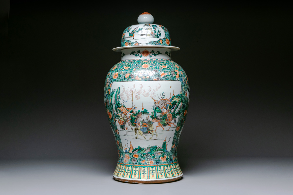 A very large Chinese famille verte 'warriors on horseback' vase and cover, 19th C.