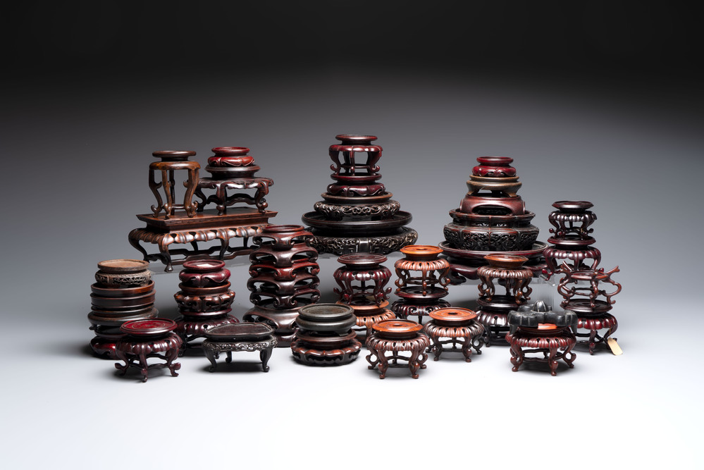 A collection of 45 Chinese wooden stands, 19/20th C.