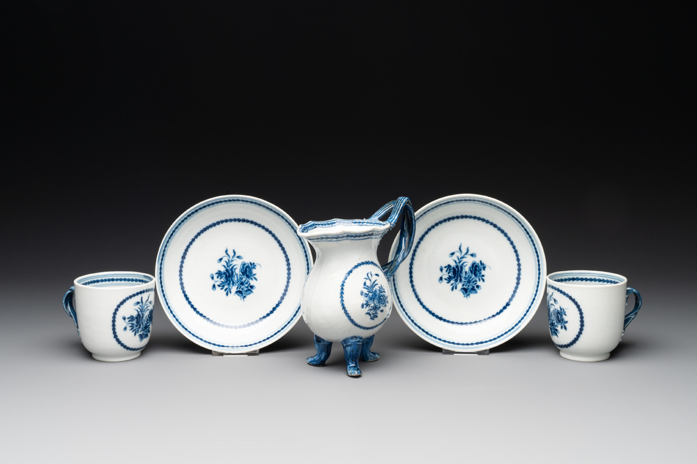 A pair of Chinese blue and white handled cups and saucers and a milk jug, Qianlong/Jiaqing