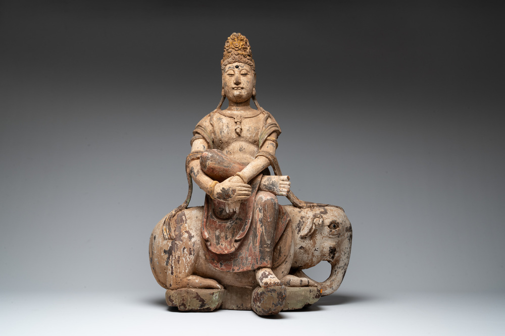 A large Chinese polychromed wooden Guanyin seated on an elephant, Republic