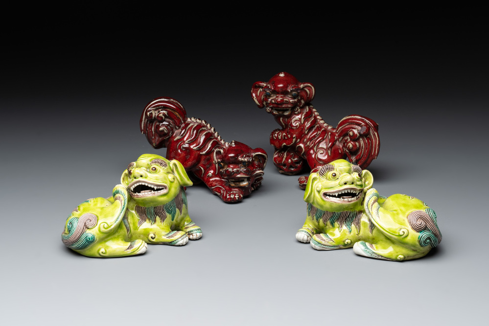 A pair of Chinese lime-green-glazed Buddhist lions and a pair of flamb&eacute;-glazed Shiwan Buddhist lions, 19/20th C.