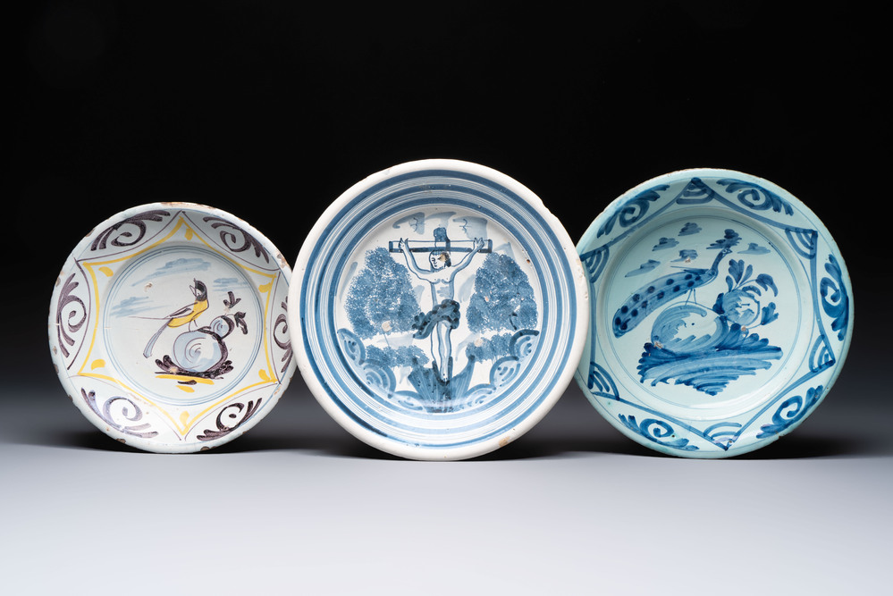 A polychrome maiolica dish and two blue and white dishes, Northern Netherlands, 17/18th C.