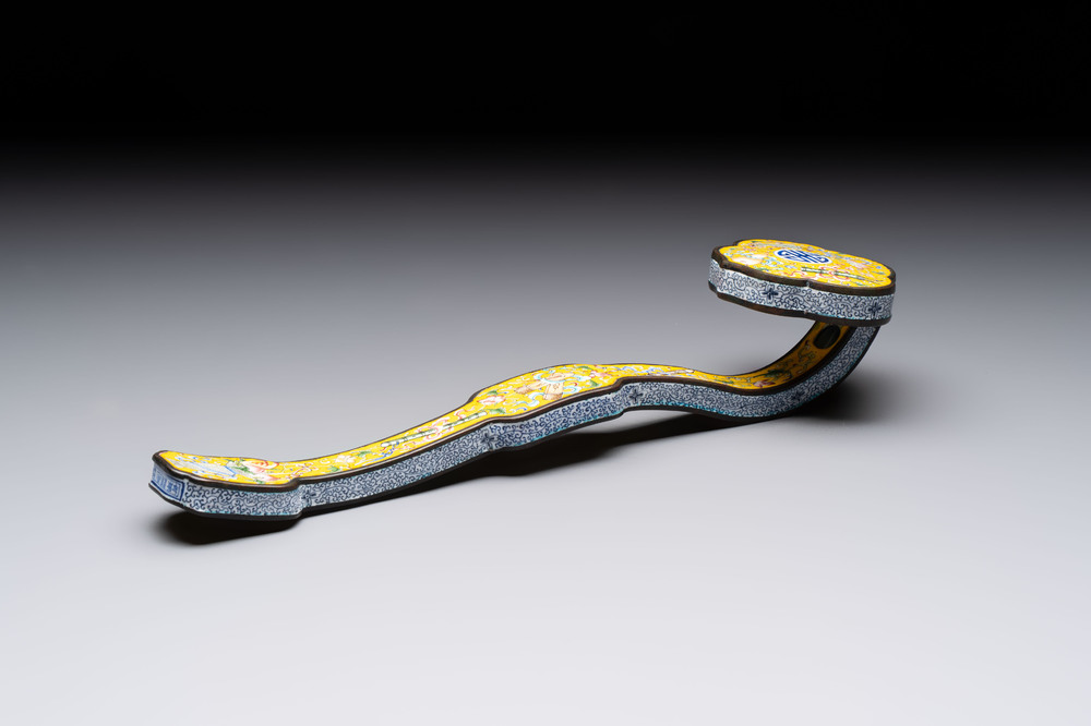 A Chinese Beijing enamel yellow-ground 'Bajixiang' ruyi sceptre, Qianlong mark, 19/20th C.
