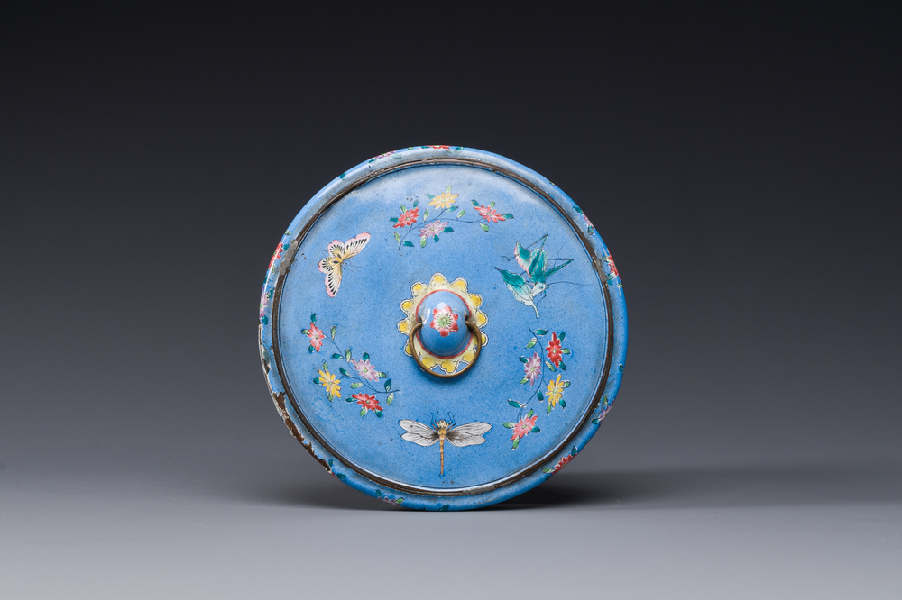 A Chinese Canton enamel blue-ground circular hand mirror, early 19th C.