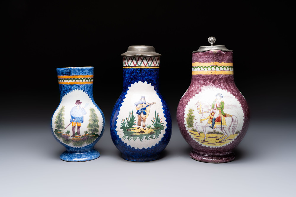 Three Brussels faience jugs, two with pewter mounts, 19/20th C.