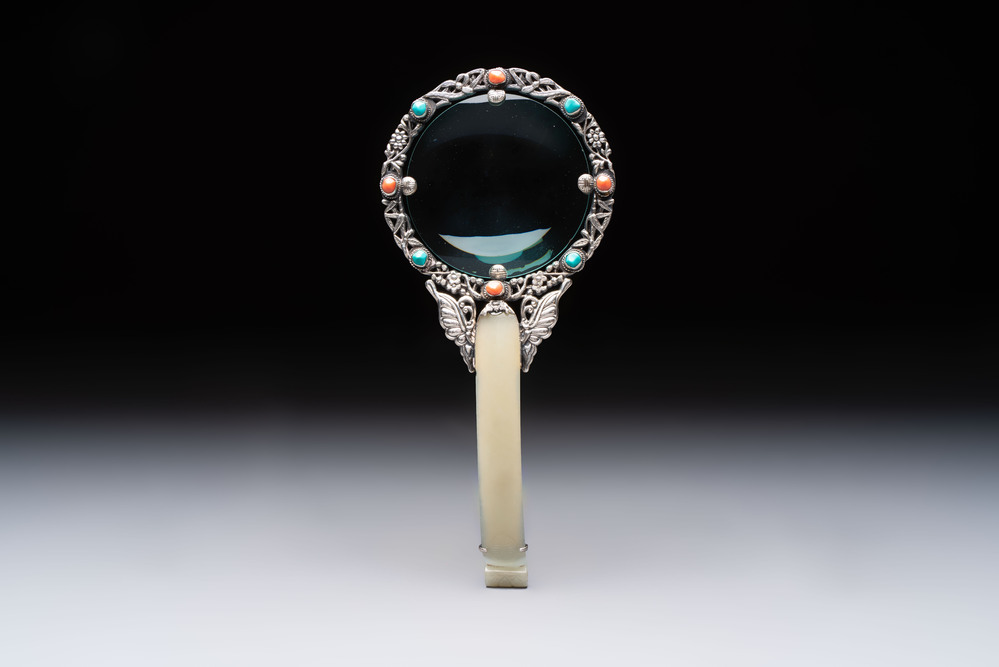 A Chinese silver-mounted magnifying glass with jade handle and precious stone inlays, 19th C.