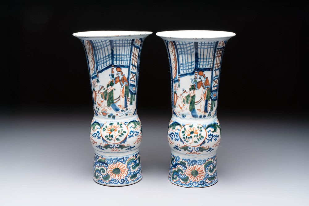 A pair of unusual polychrome Dutch Delft Kangxi-style chinoiserie beaker vases, early 18th C.