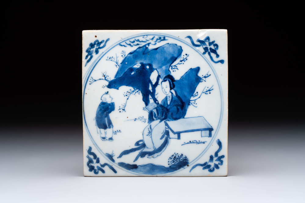 A Chinese blue and white 'elegant beauty and boy' tile, Kangxi