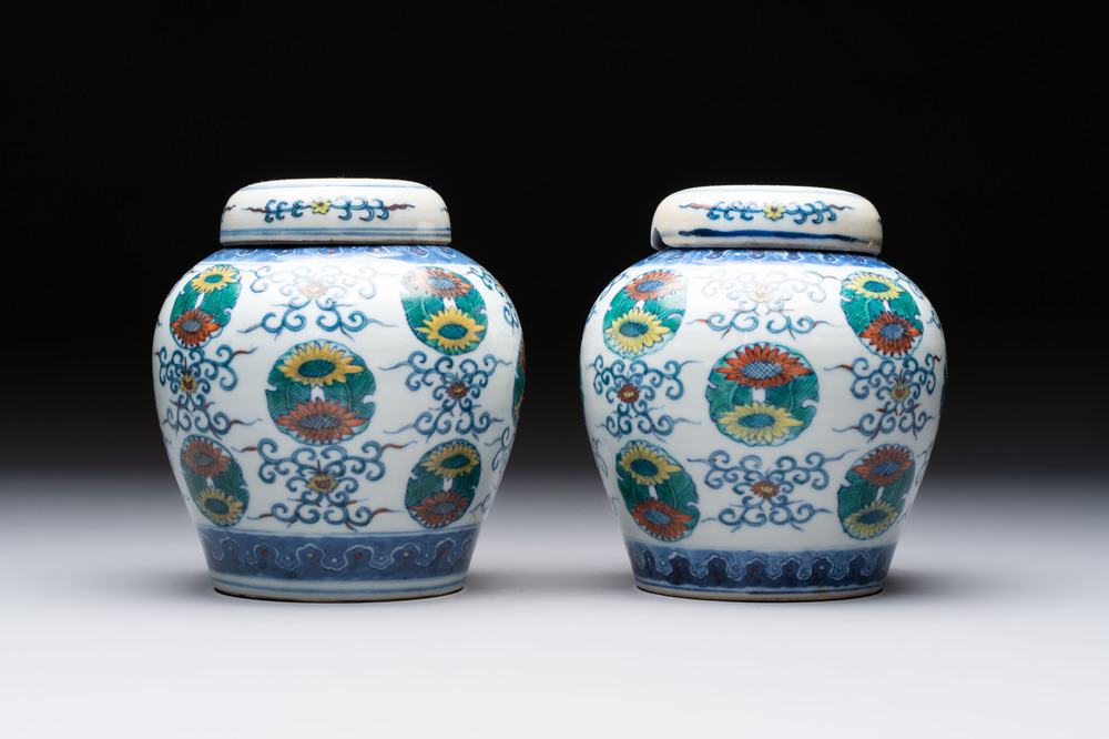 A pair of Chinese doucai 'chrysanthemum' jars and covers, Daoguang mark and of the period