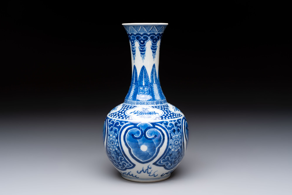 A Chinese blue and white vase with floral design, 19th C.