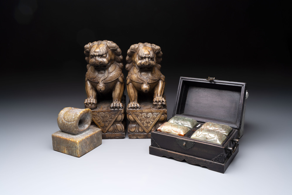 A pair of Chinese carved stone Buddhist lions, a large seal and a wooden box with four seals, 20th C.