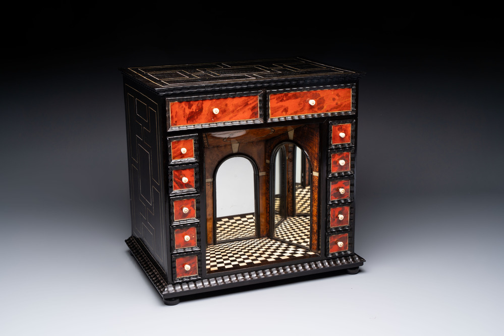 A small tortoiseshell-veneered cabinet of drawers with mirrored interior, Antwerp, 17th C.