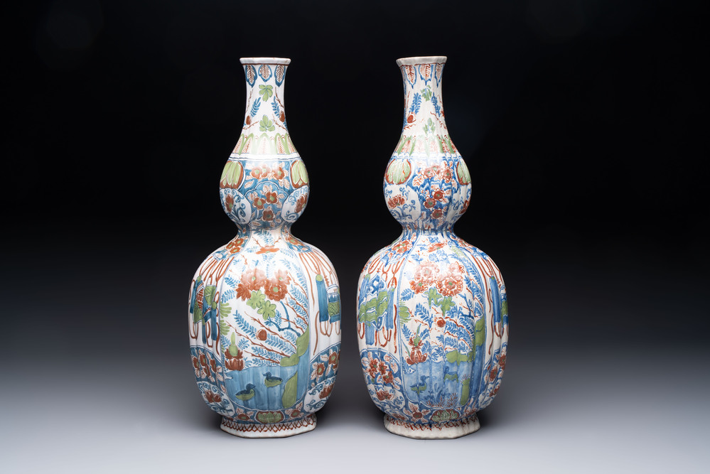 A pair of polychrome Dutch Delft double gourd vases, 19th C.