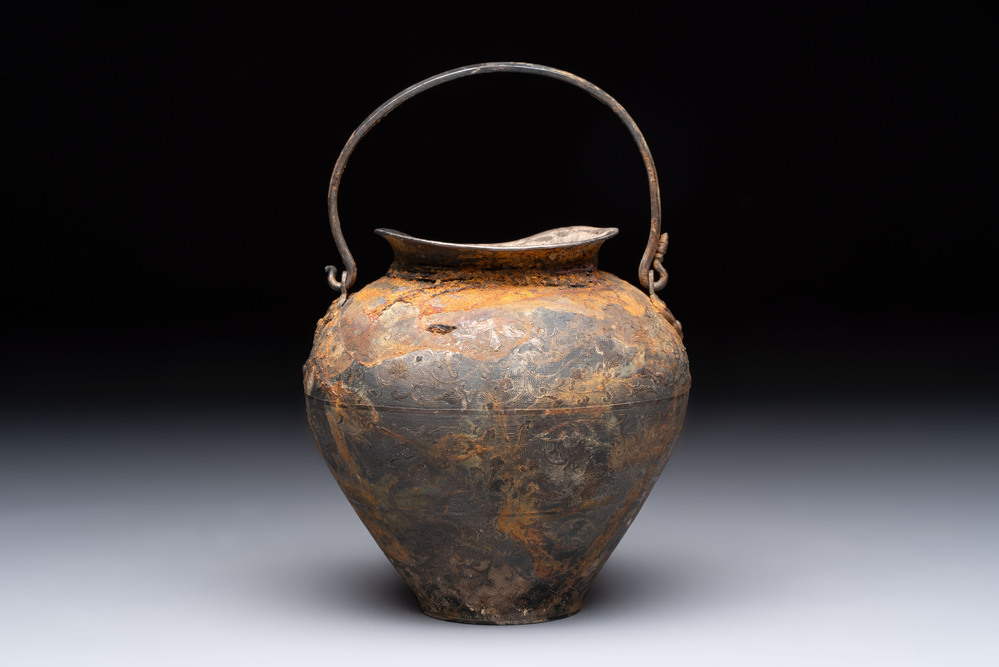 A rare Chinese parcel-gilt silver handled jar with floral scroll design, Tang