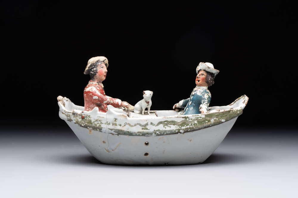 A cold-painted white Dutch Delft 'rowing boat' group, 18th C.