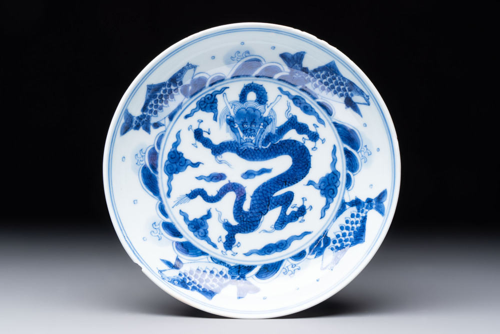 A Chinese blue and white 'dragon and carps' plate, Yongzheng mark and of the period