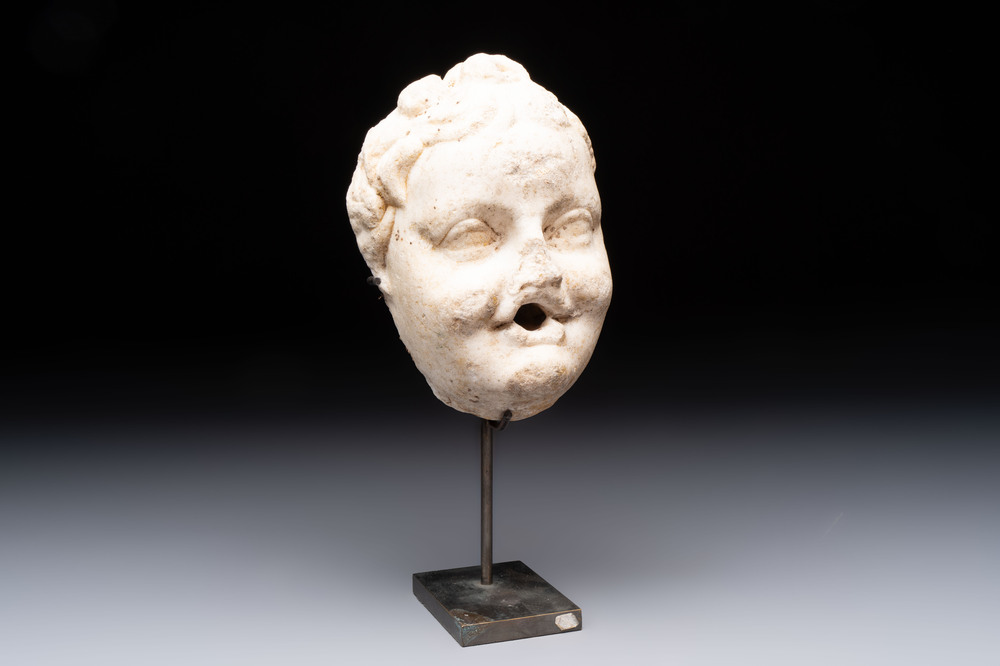 A marble 'putto head' fountain spout, France or Italy, 19th C. or earlier