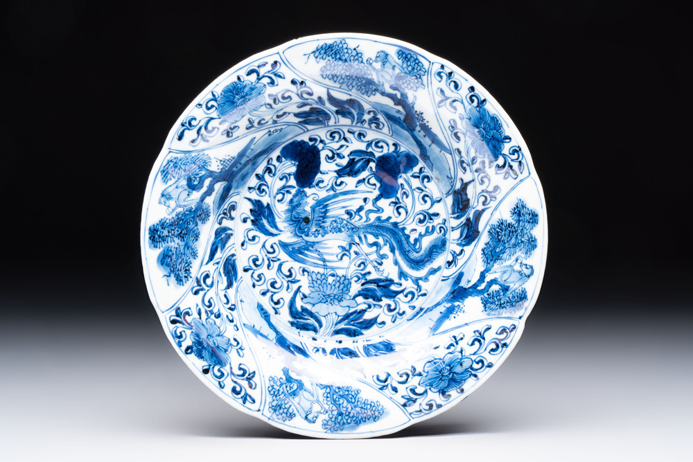 A Chinese blue and white lobed 'phoenix and monkey' plate, flower mark, Kangxi