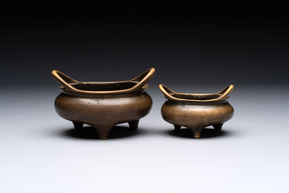 Two Chinese bronze tripod censers, Xuande marks, 19th C.