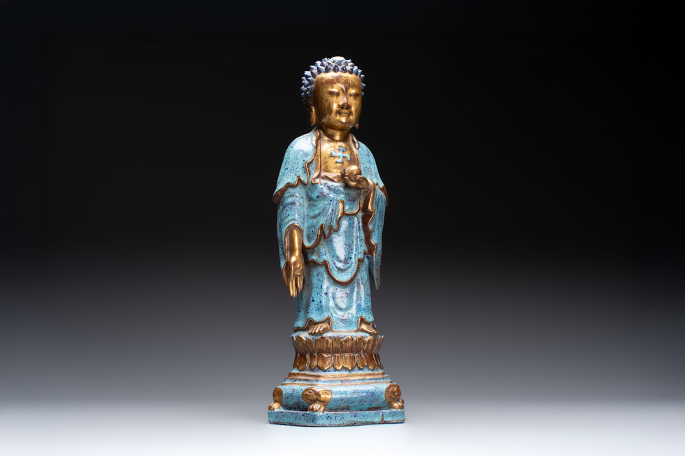 A Chinese robin's egg-glazed gilt-decorated standing Buddha, 18th C.