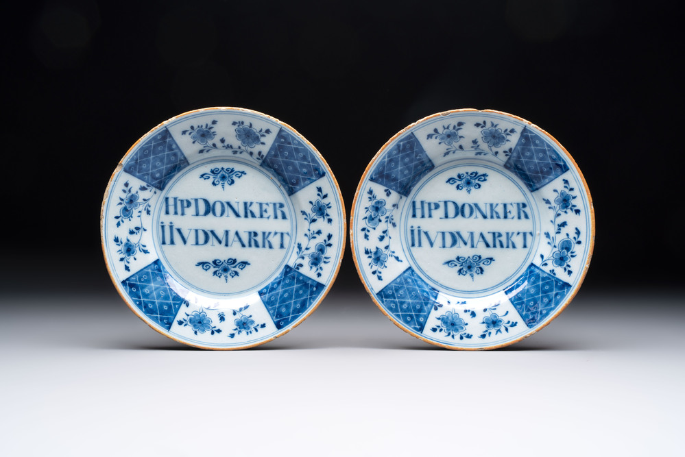 A pair of blue and white Dutch Delft inscribed plates, 18th C.