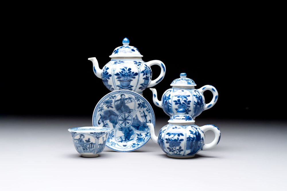 Three Chinese blue and white teapots, a cup and a saucer, Kangxi