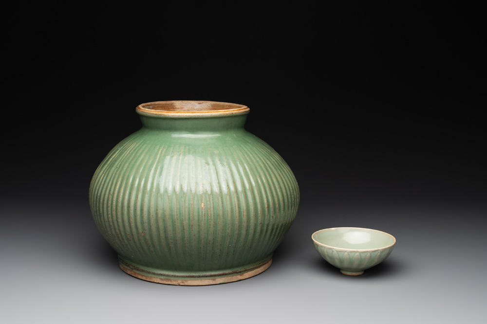 A Chinese Longquan celadon 'lotus' bowl and a large green-glazed Shiwan jar, Ming and later