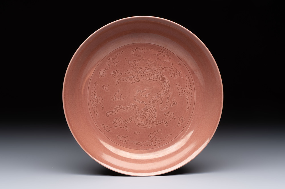 A Chinese copper-red-glazed incised 'dragon' plate, Guangxu mark and possibly of the period