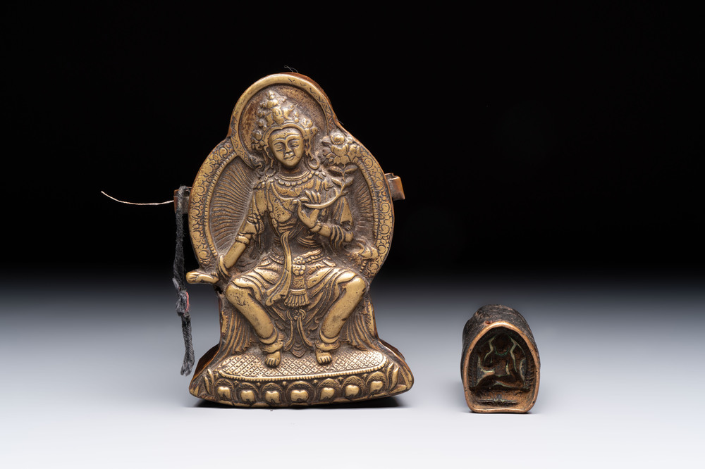 A Tibetan copper Gawu box and tsa tsa mold, 19th C.