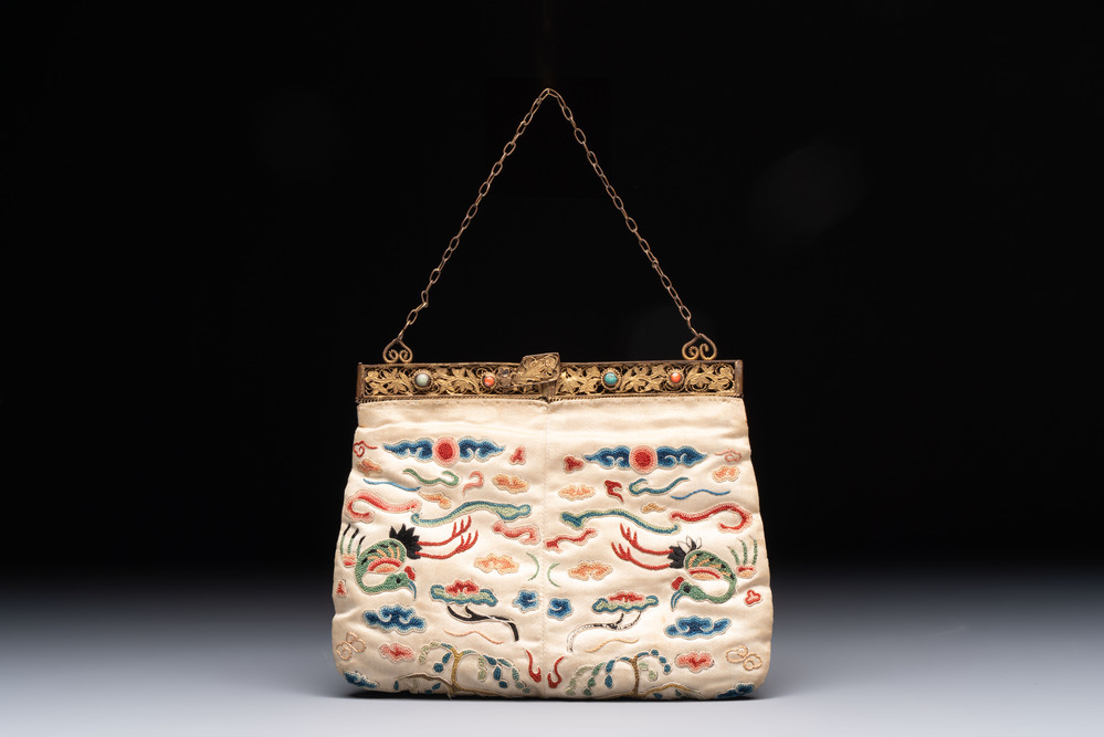 A Chinese embroidered silk purse with red coral- and turquoise-inlaid gilt-bronze mounts, Qing