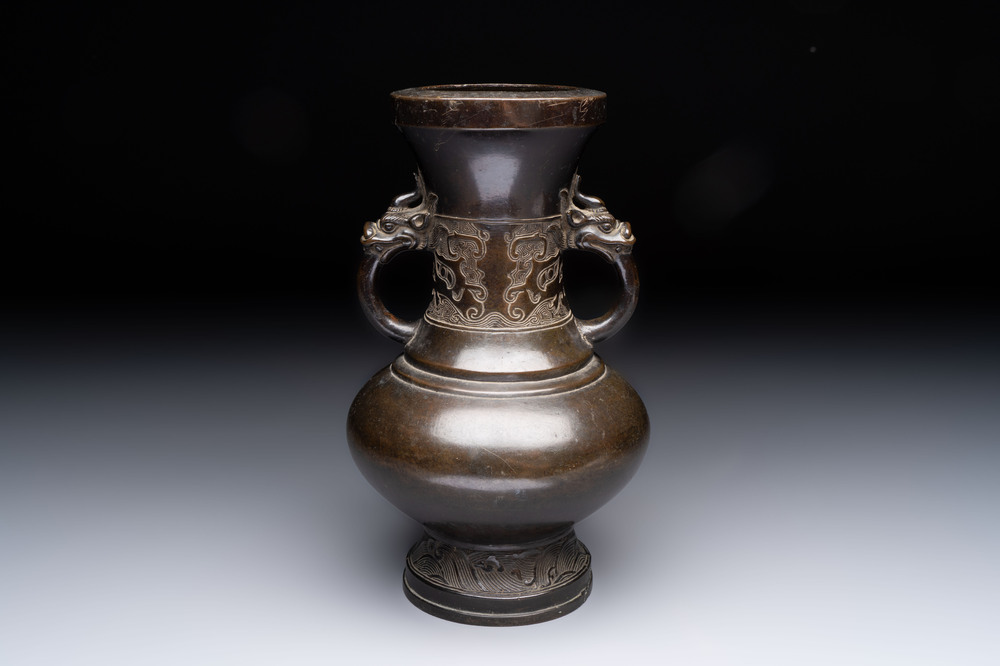 A Chinese archaistic bronze vase with 'mythical beast' handles, Yuan/Ming