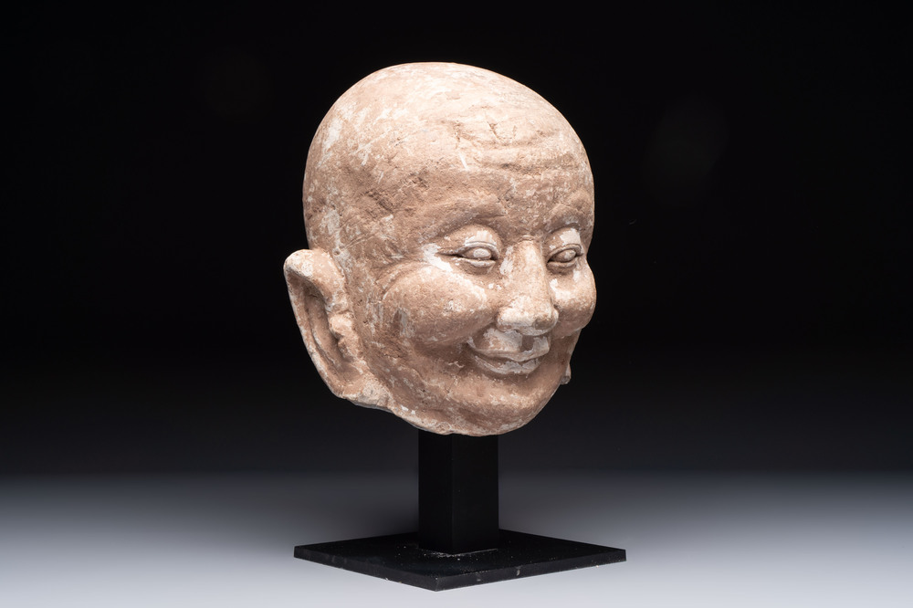 A Chinese sandstone head of a Luohan, Ming