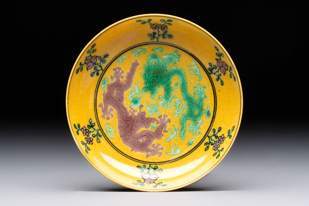A Chinese yellow-ground aubergine and green-enamelled 'dragon' saucer, Daoguang mark and of the period