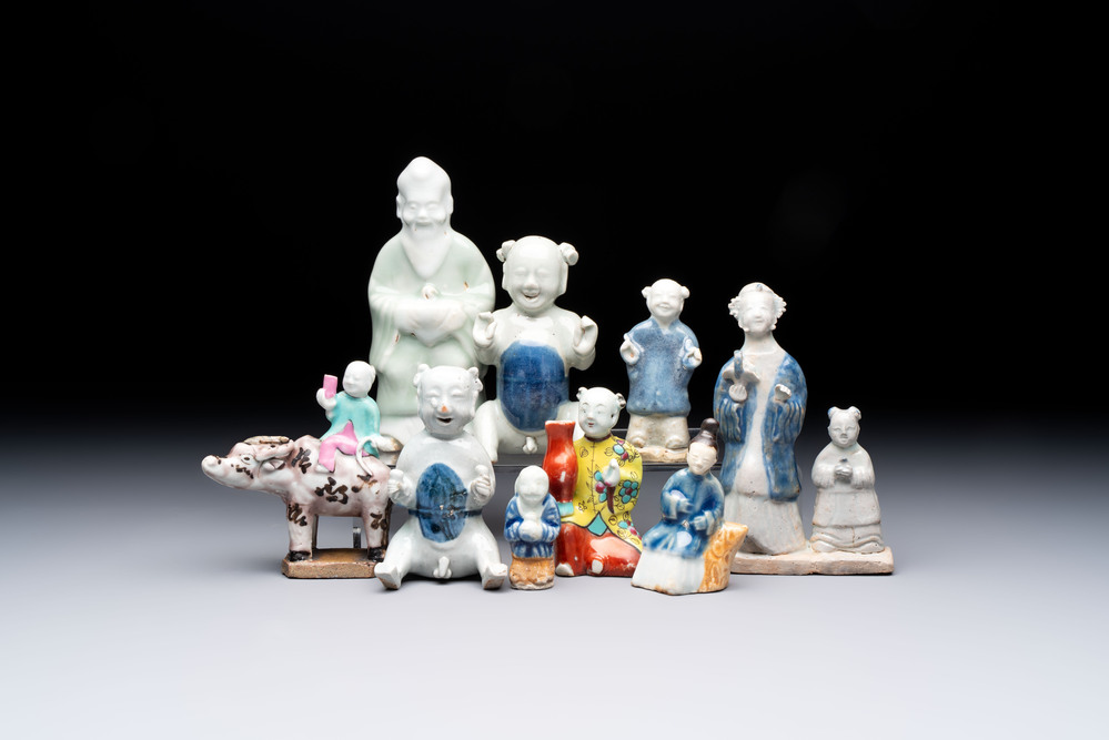 Nine Chinese blue, white, celadon-glazed and famille rose figures, 18/19th C.