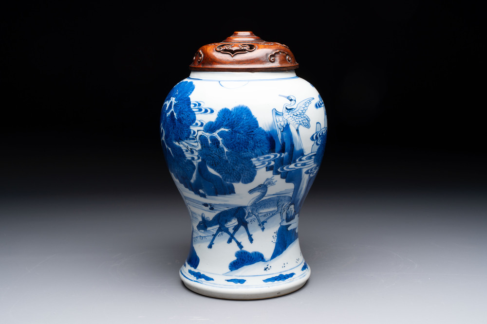 A Chinese blue and white 'He Lu Tong Chun 鶴鹿同春' vase and a wooden cover, Kangxi