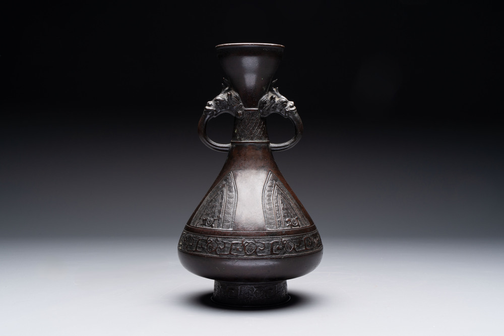 A Chinese archaistic bronze vase with dragon-form handles, Yuan/Ming
