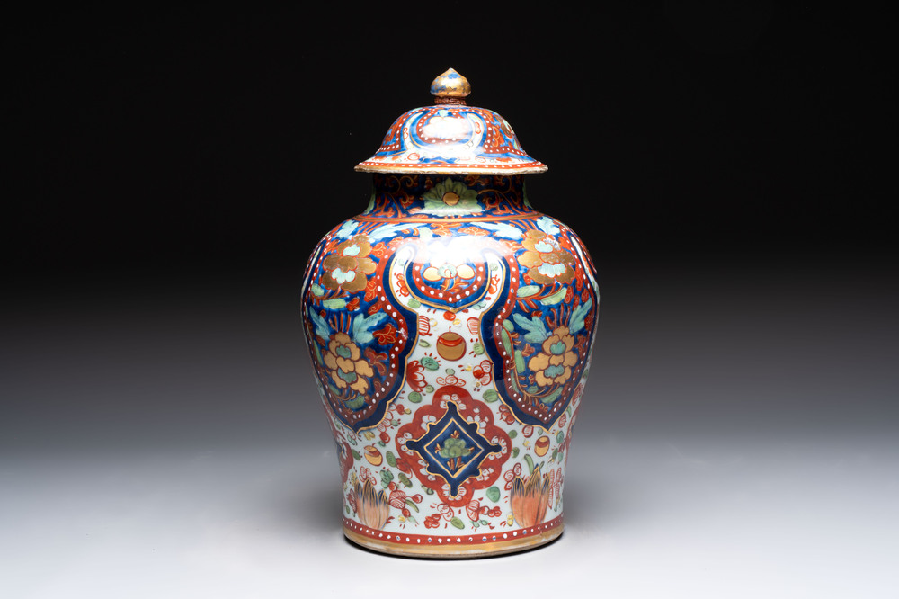 A Chinese English-decorated blue and white vase and cover, Kangxi